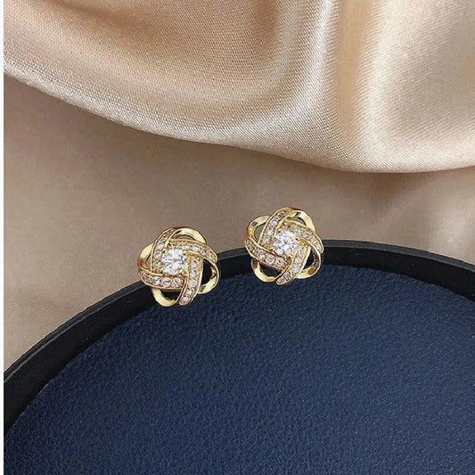 Boucles d'Oreilles Spirales Dorées avec Cristaux