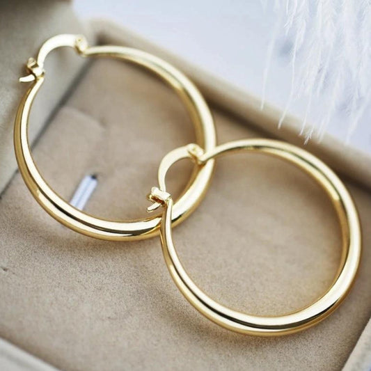 Boucles d'Oreilles Dorées à Grand Impact