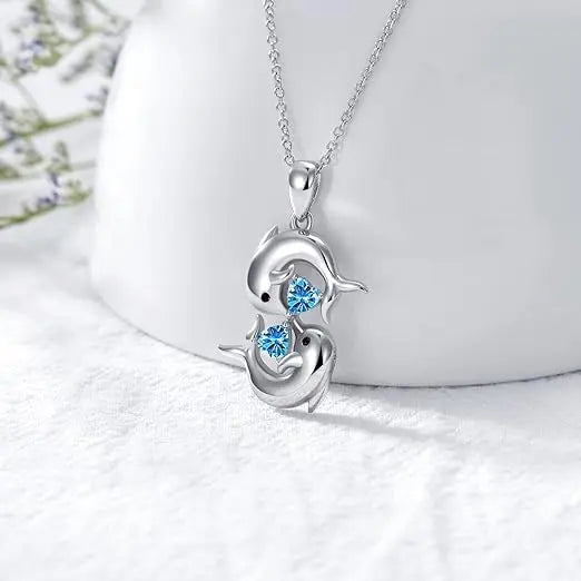 Collier Argenté avec Double Dauphin et Cristal Bleu