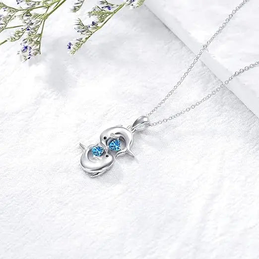 Collier Argenté avec Double Dauphin et Cristal Bleu