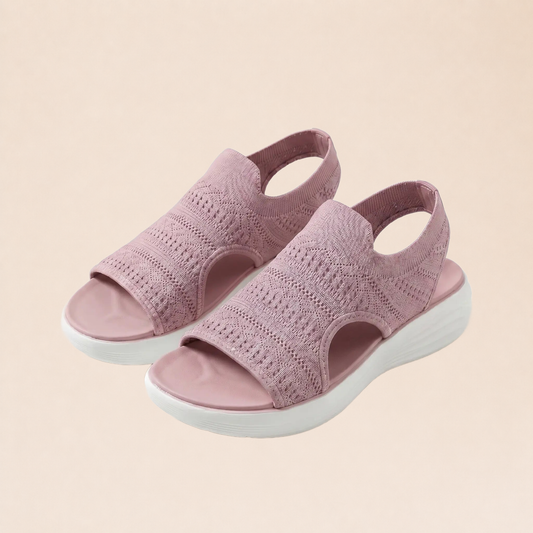 Sandales orthopédiques roses sur fond beige