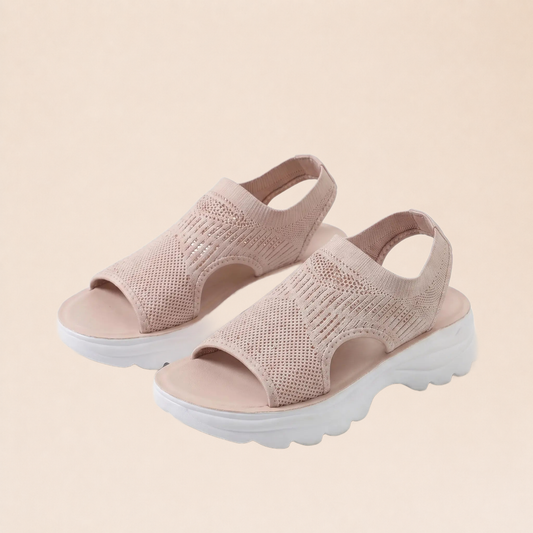 Sandales orthopédiques roses sur fond beige